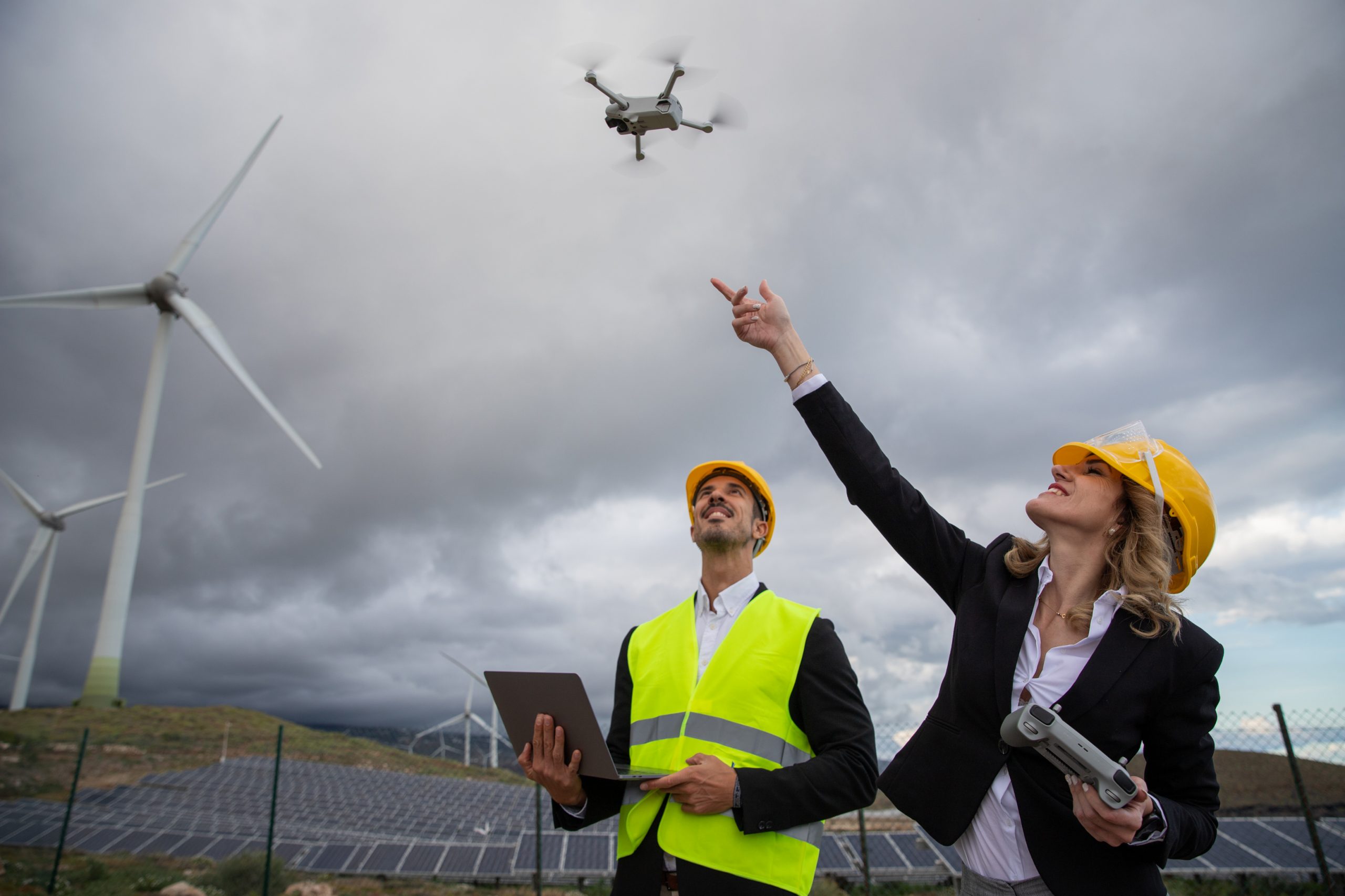 two-engineers-at-work-fly-a-drone-and-use-the-lapt-2023-11-27-05-34-27-utc